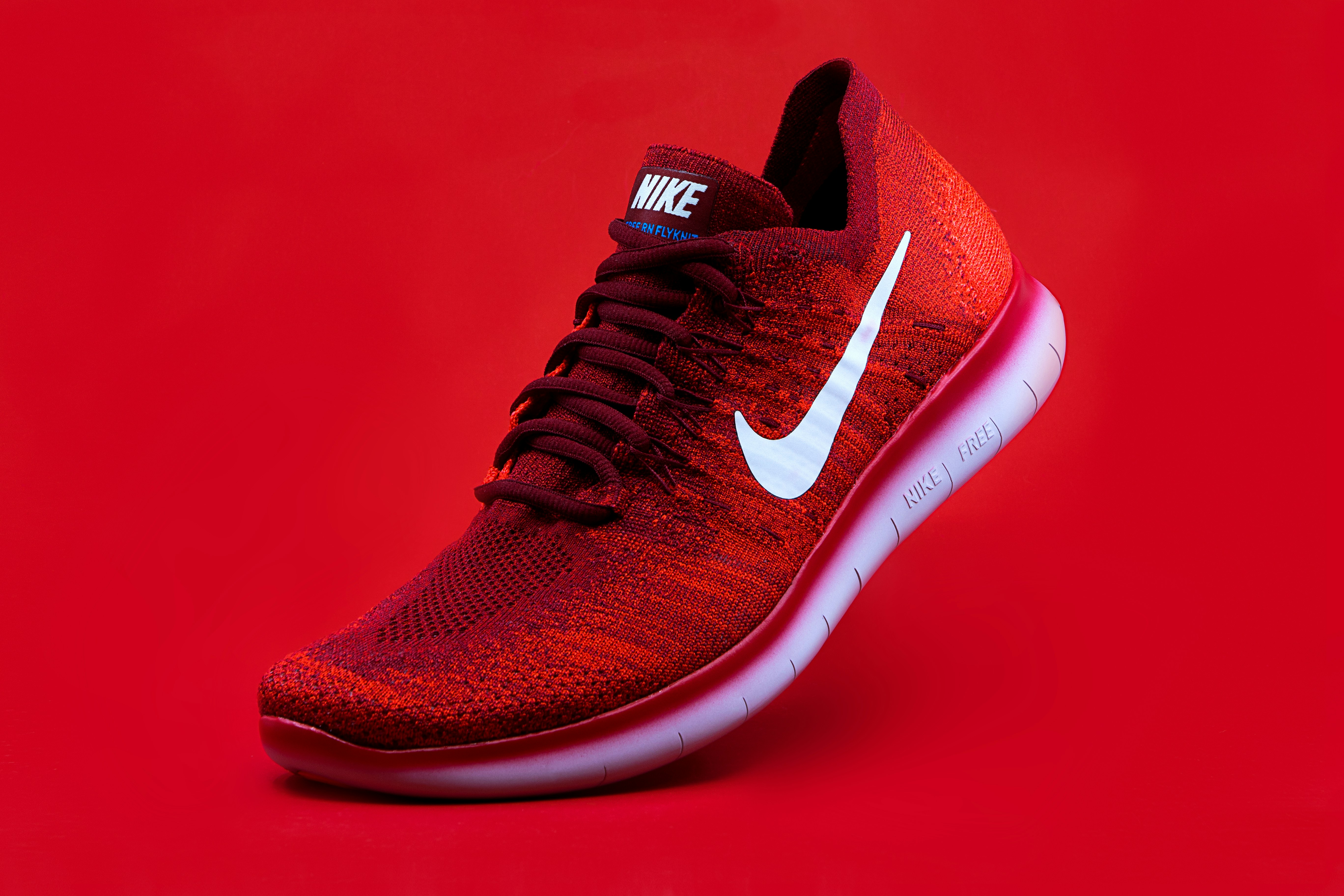 Photo by Domino unpaired red Nike sneaker